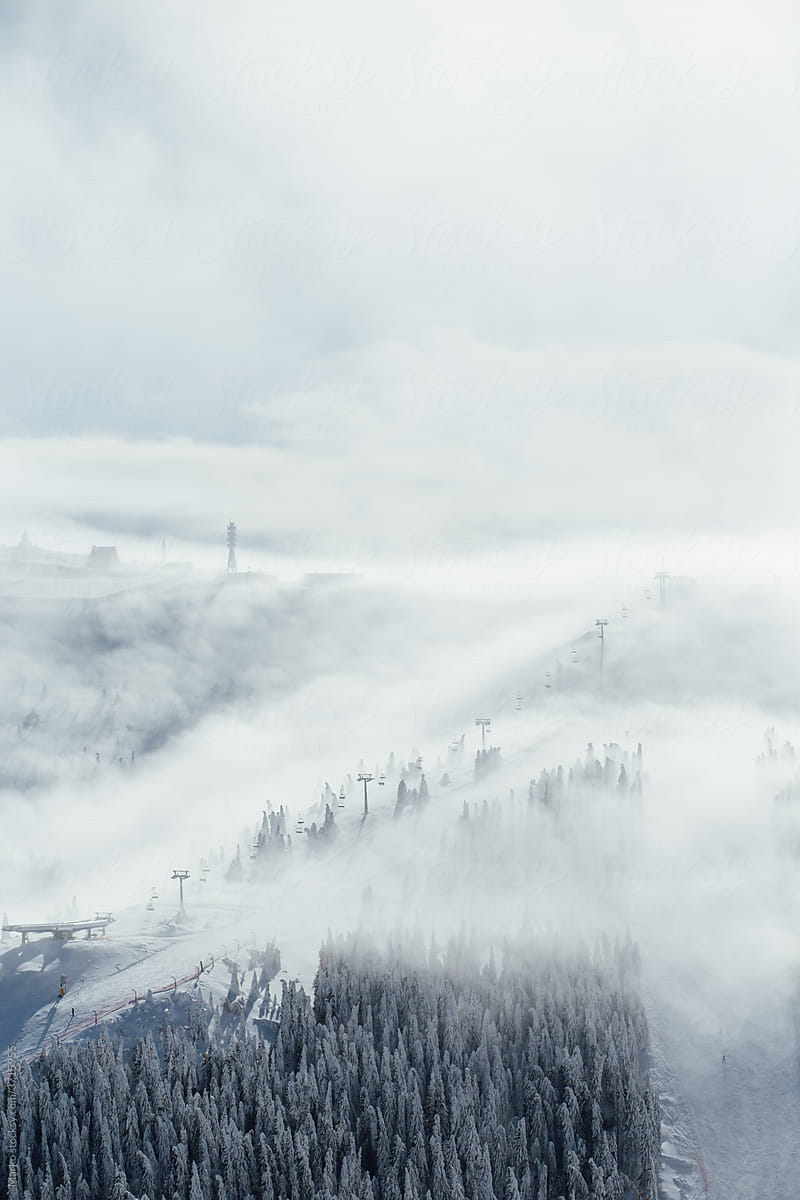 Ski lift mountain landscape cloud fog