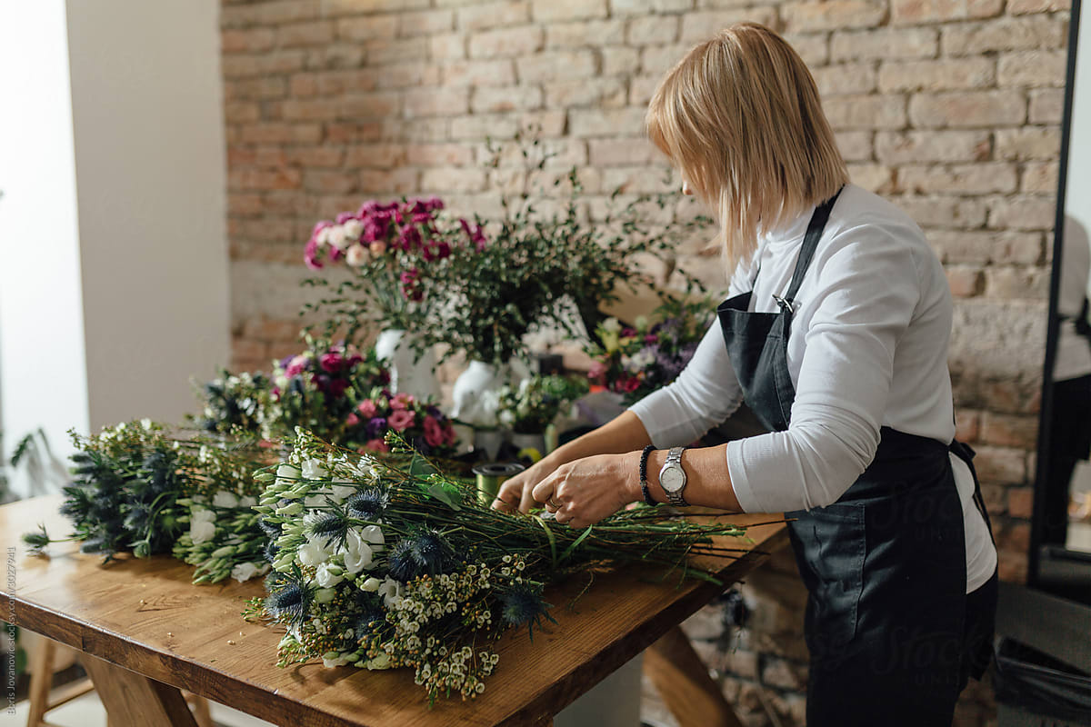 Woman Arranging A Bouquet