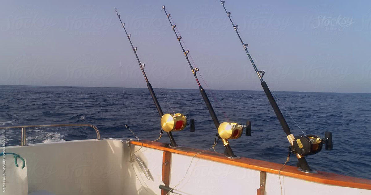 Fishing Rods On A Fishing Boat by Stocksy Contributor Marco Govel