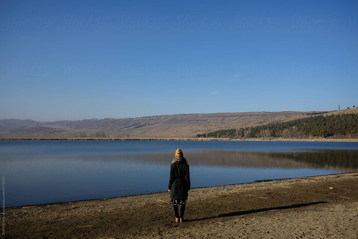 Woman at the lake in fall season