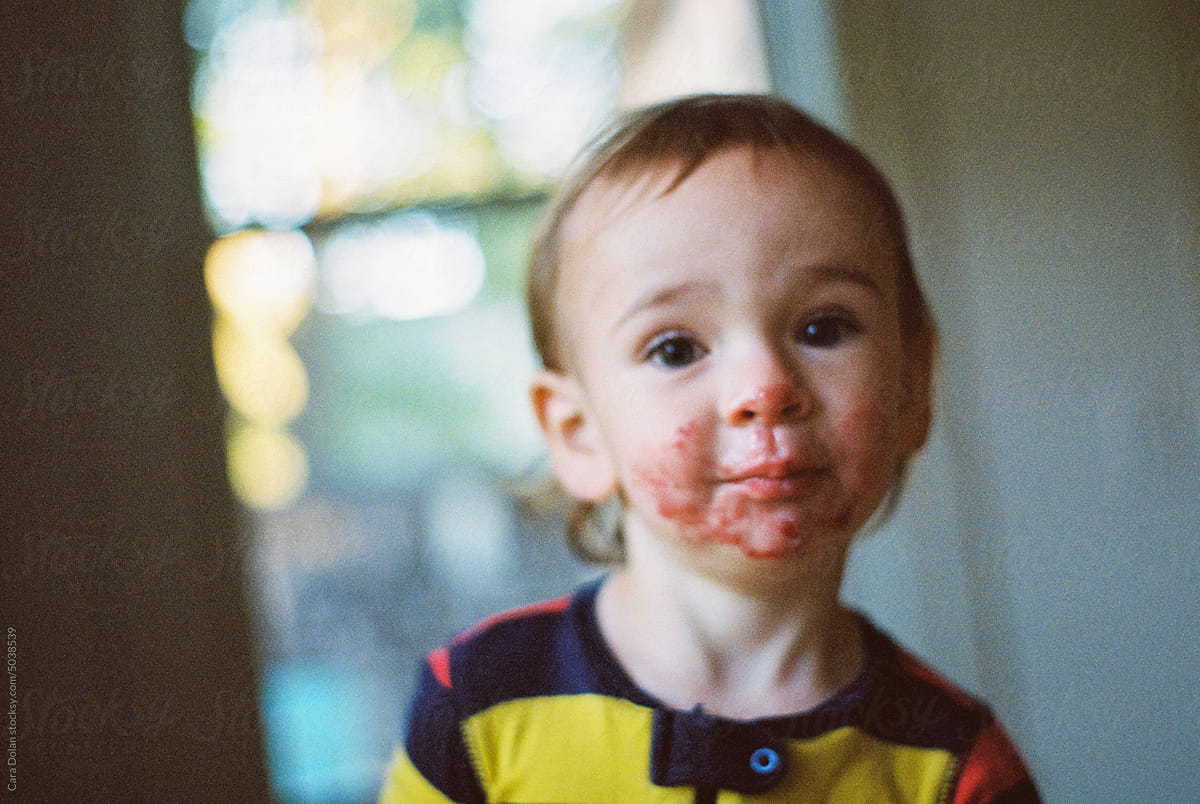 Out of Focus Portrait of Toddler with Jelly on his Face