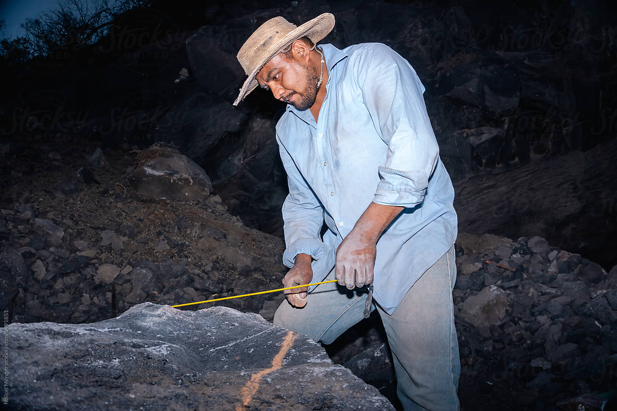 Man in volcanic stone mine