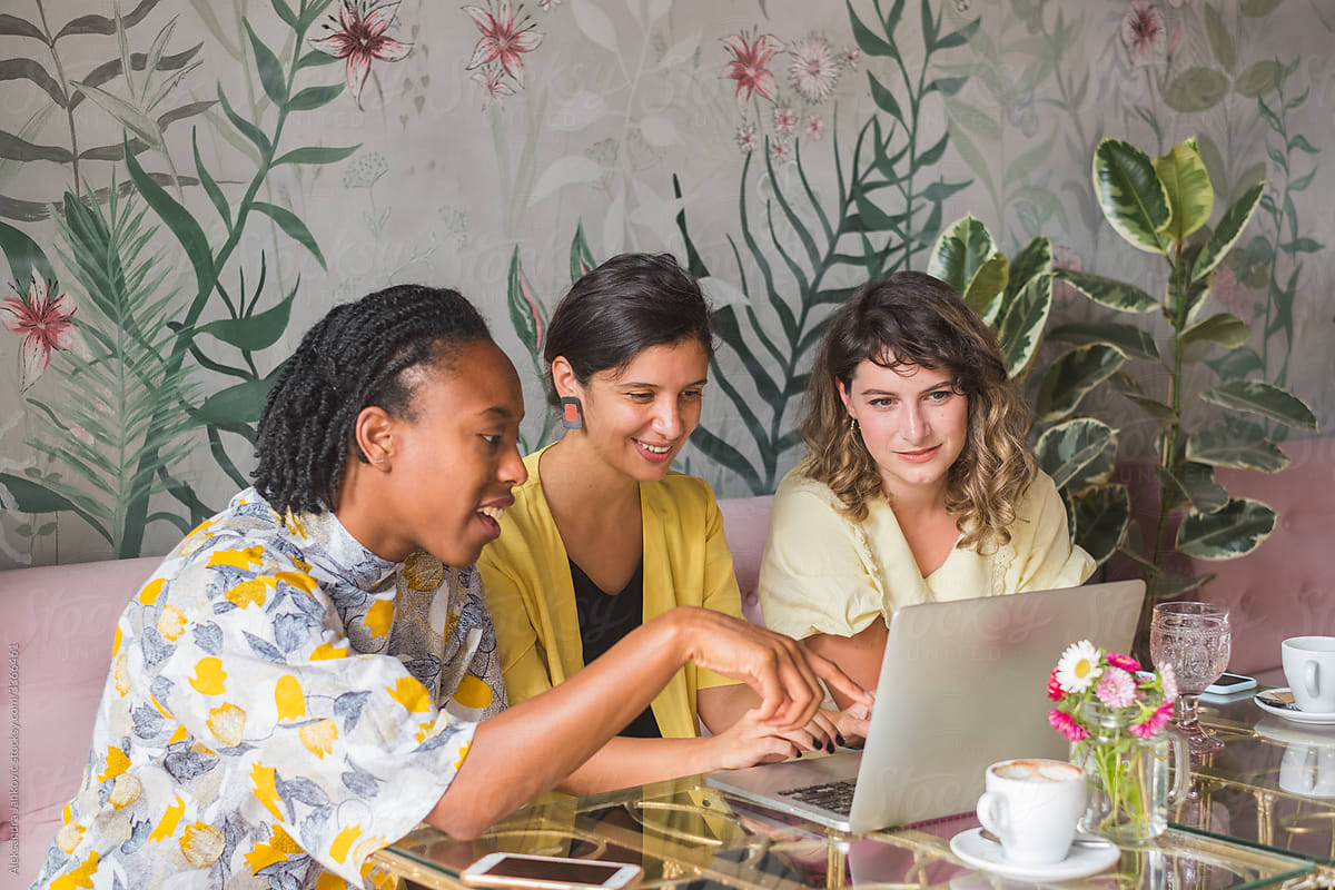 Female Entrepreneurs Having A Meeting And Using Laptop