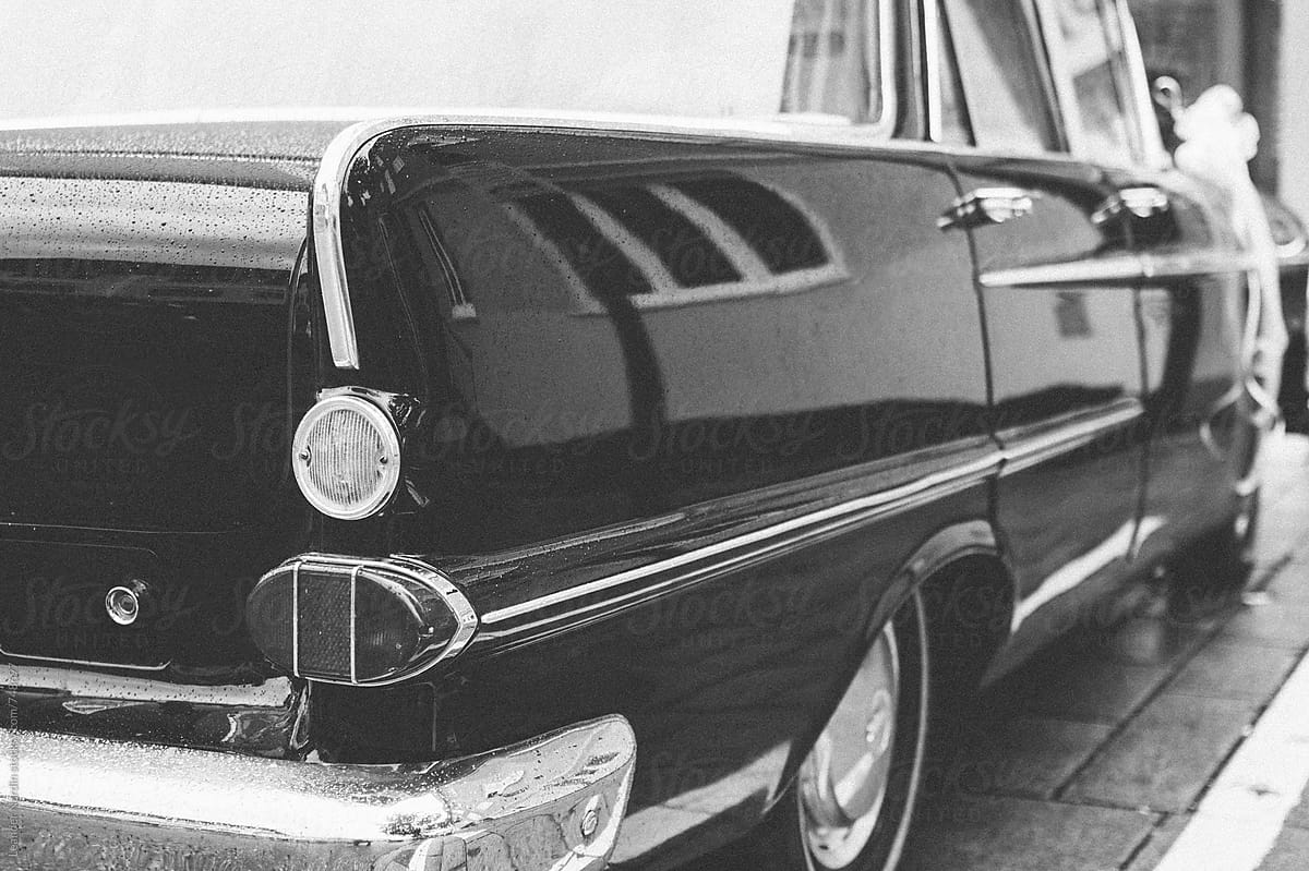 rear view of a classic oldtimer car in black and white