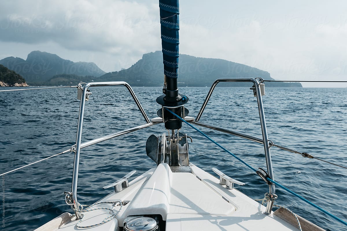 Bow of yacht sailing on water.