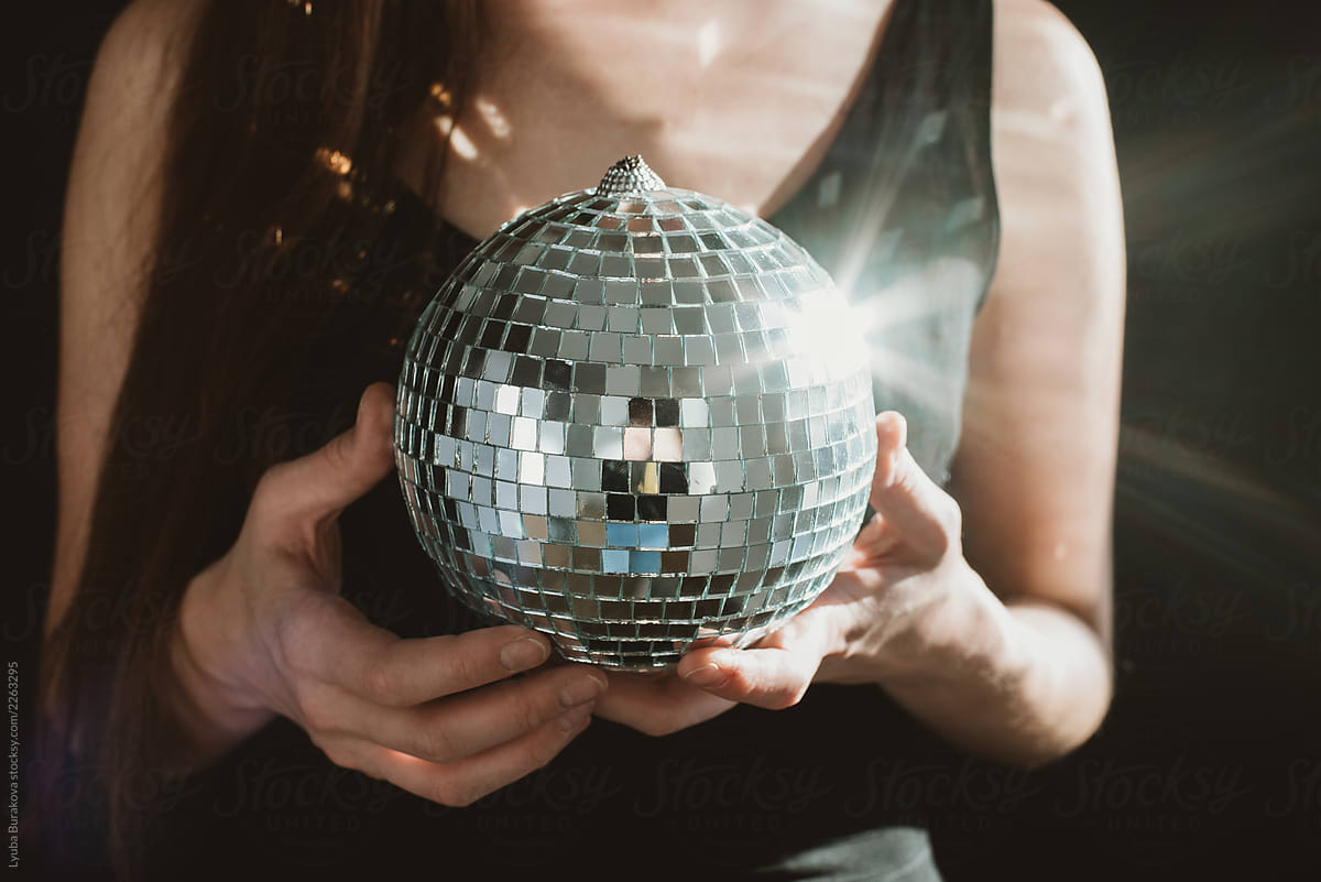 Woman holding disco-ball