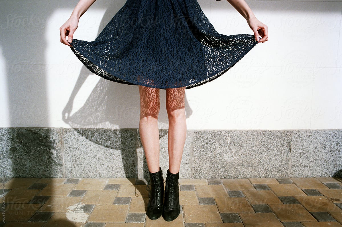 Close Up Shot Of Womans Legs With Shadow From The Lace Skirt By Stocksy Contributor Amor 7595