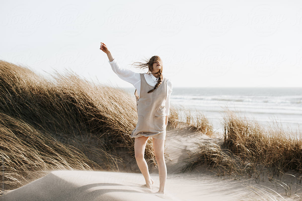 Girl Dancing On Sand Dune By Stocksy Contributor Caleb Gaskins Stocksy 