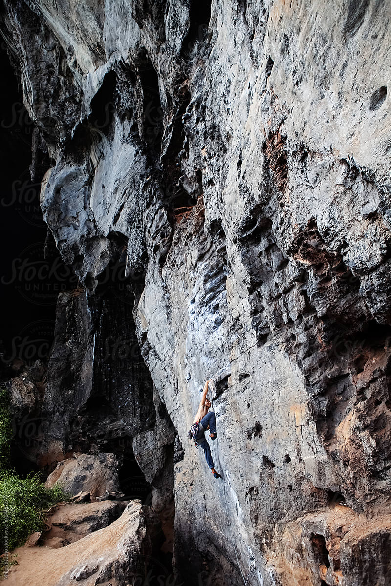 Climber on majestic rocky wall