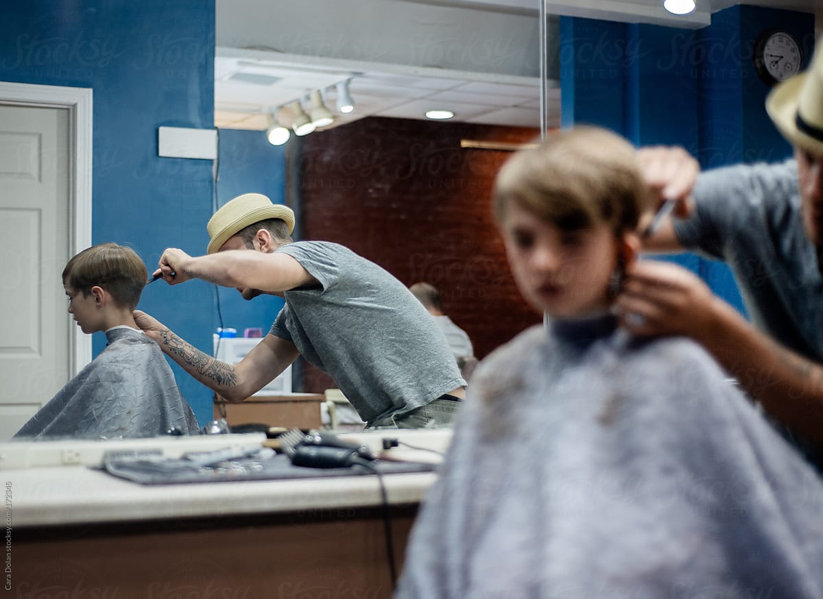 Boy gets a haircut at a barber shop
