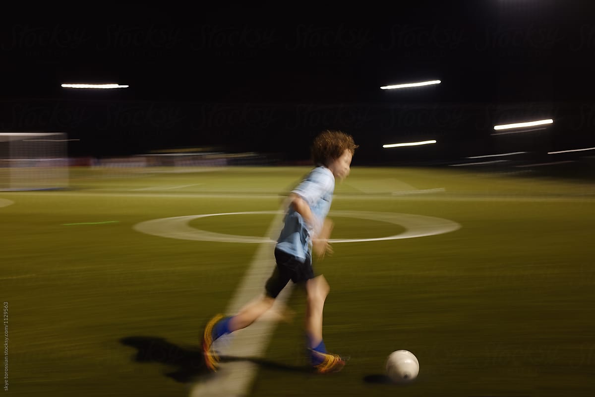 Motion blur soccer boy