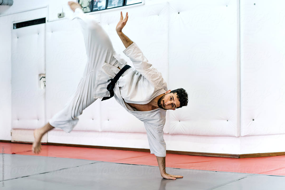 Man Practicing Karate In The Studio.