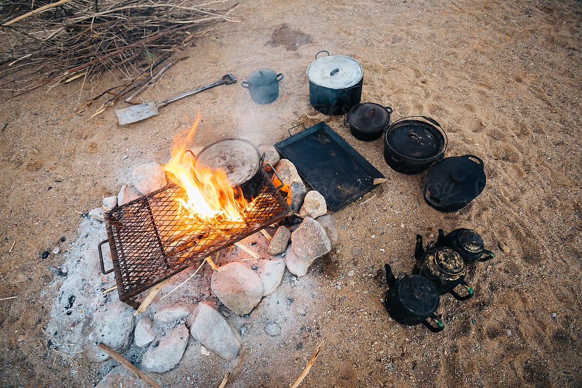Outdoor campfire cooking in the desert