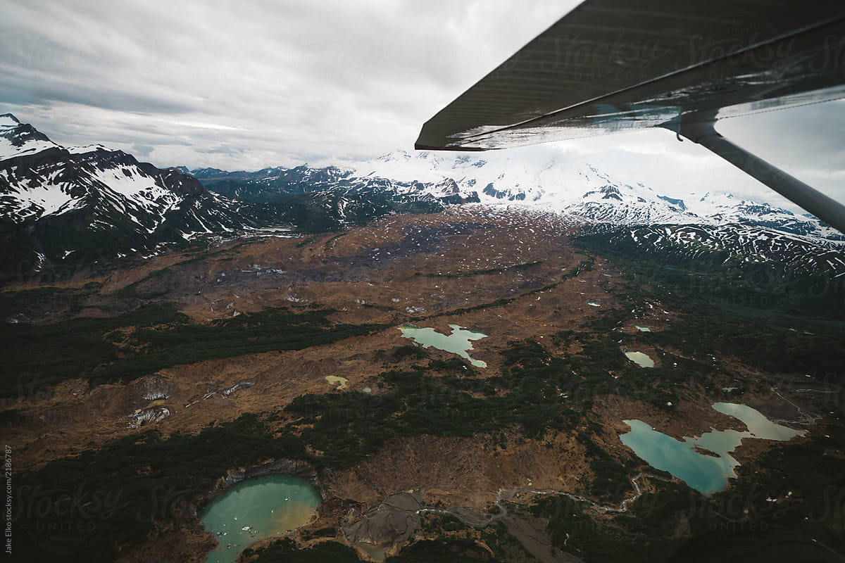 Looking Out of a Plane at Glacial Lakes In Alaska