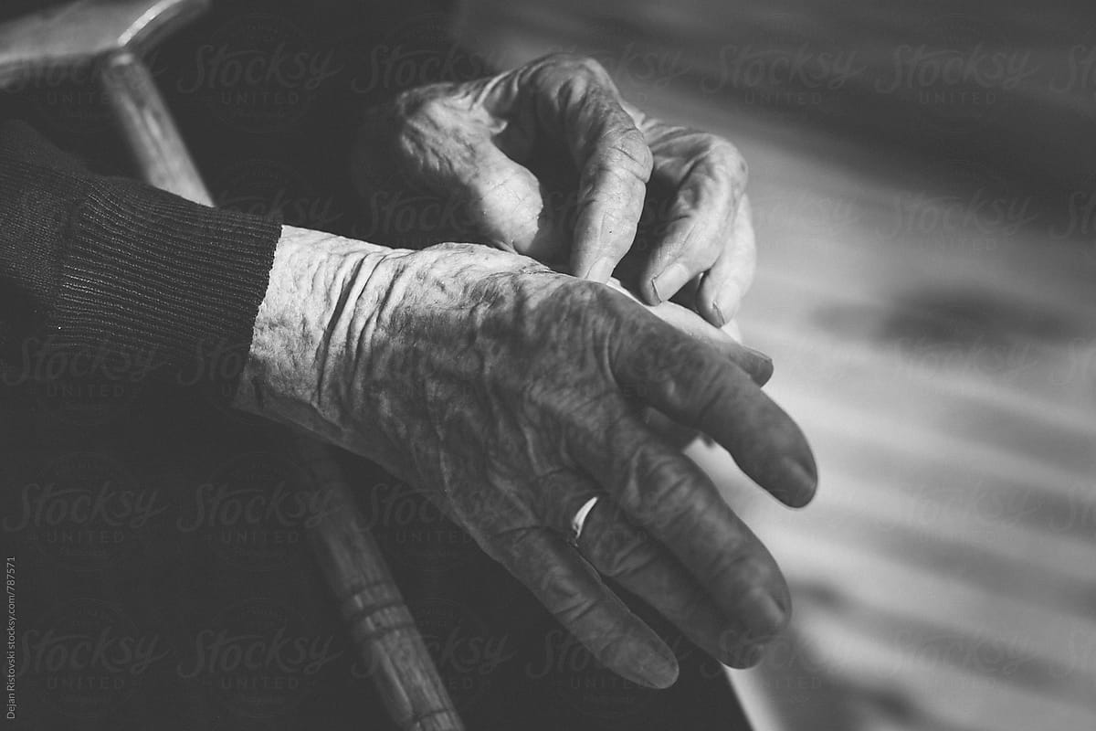 Senior woman old hands with cane