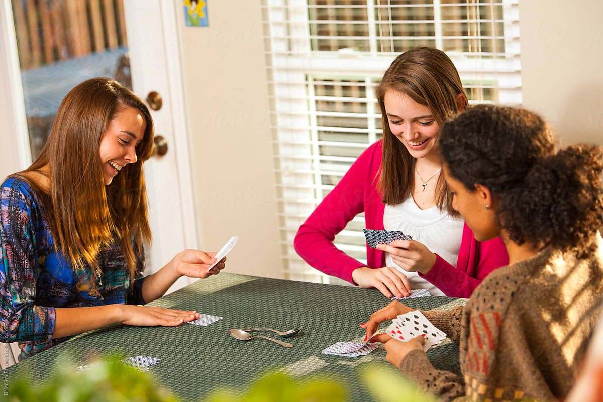 Multi-ethnic Group of Young Women Playing Cards