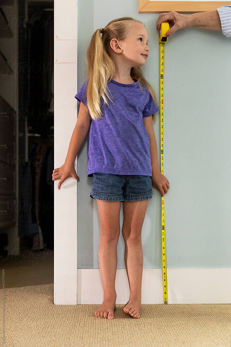 Young Girl Measuring her height