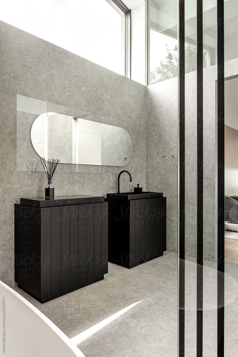 Interior of contemporary bathroom with tiled walls