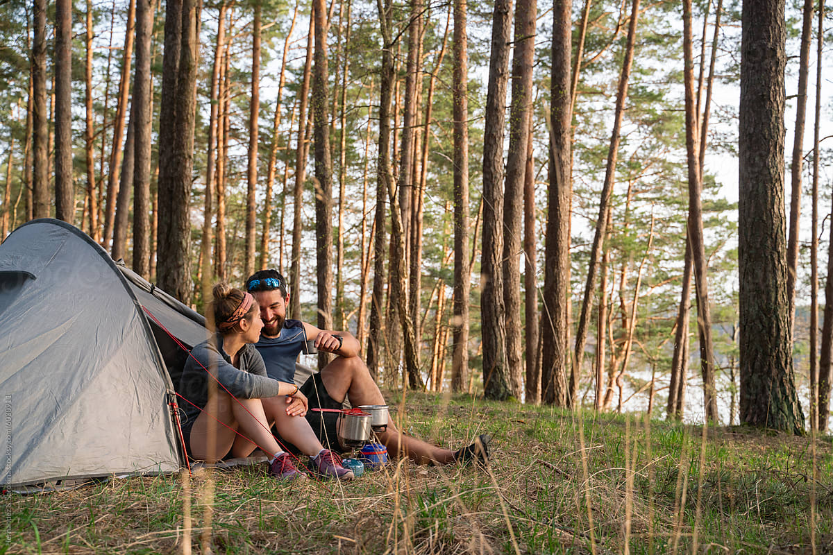 Couple Enjoying Camping Adventure In The Forest