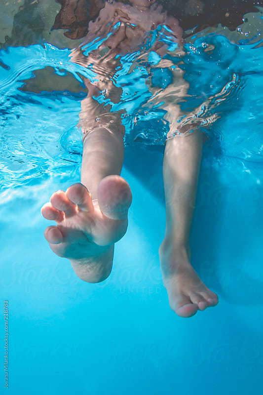 Kids Feet In The Pool Underwat