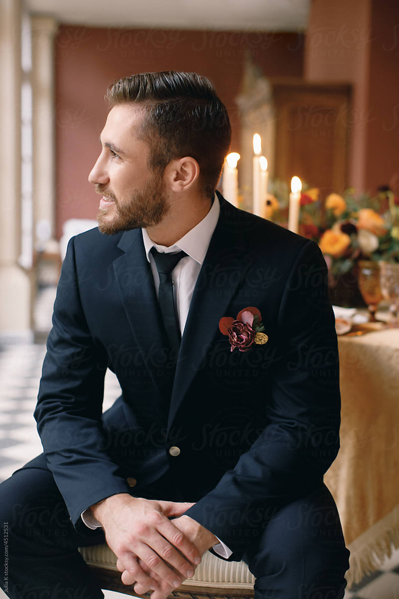 Portrait Of Groom Sitting On The Chair