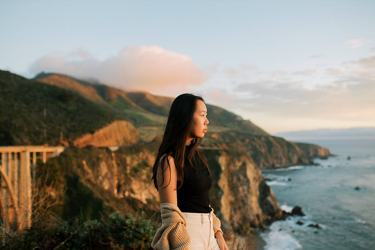 Girl Looking At Ocean In Big Sur During Sunset