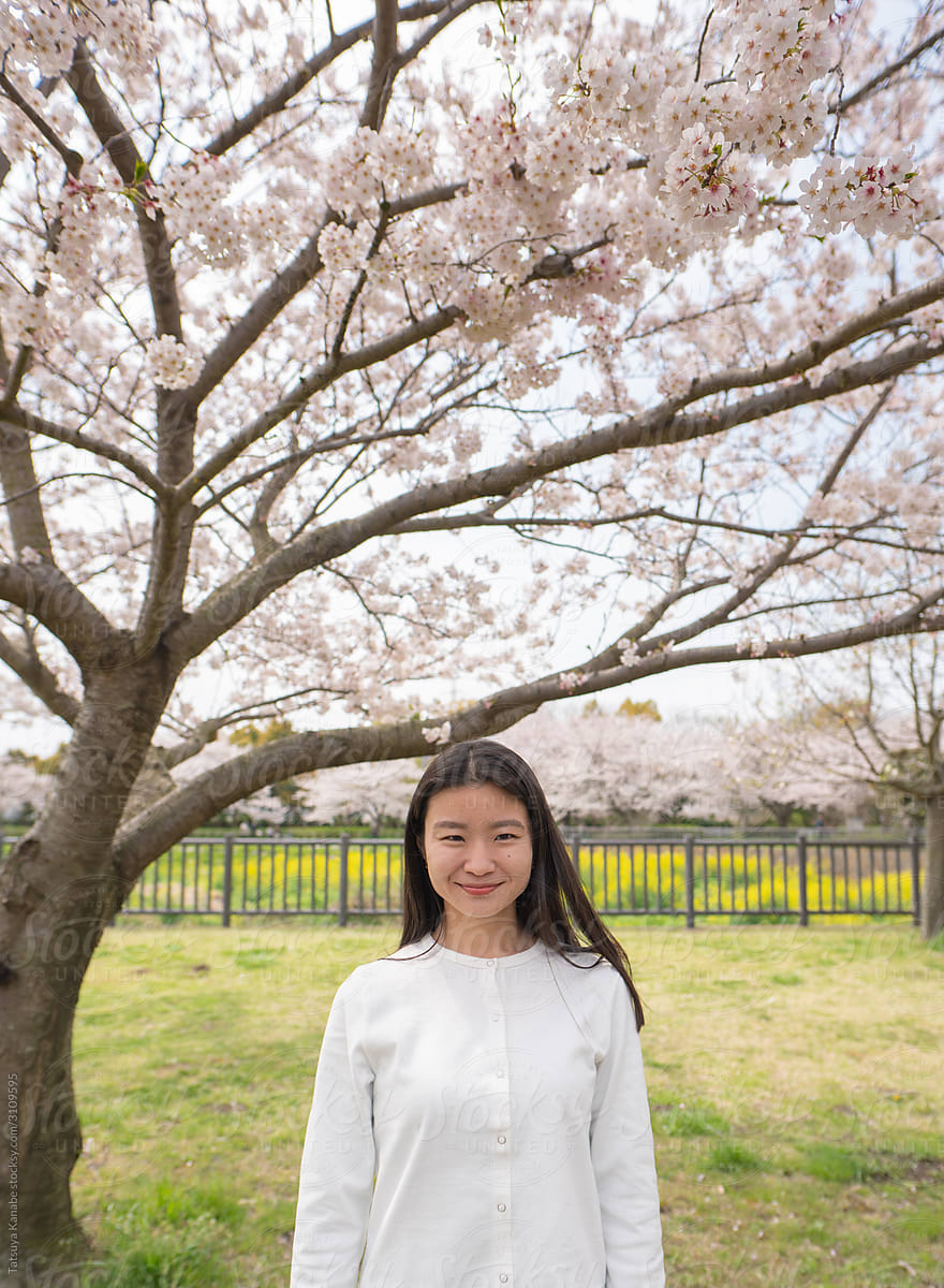 A Portrait of a Woman with Beautifully Flowing Cherry Blossom