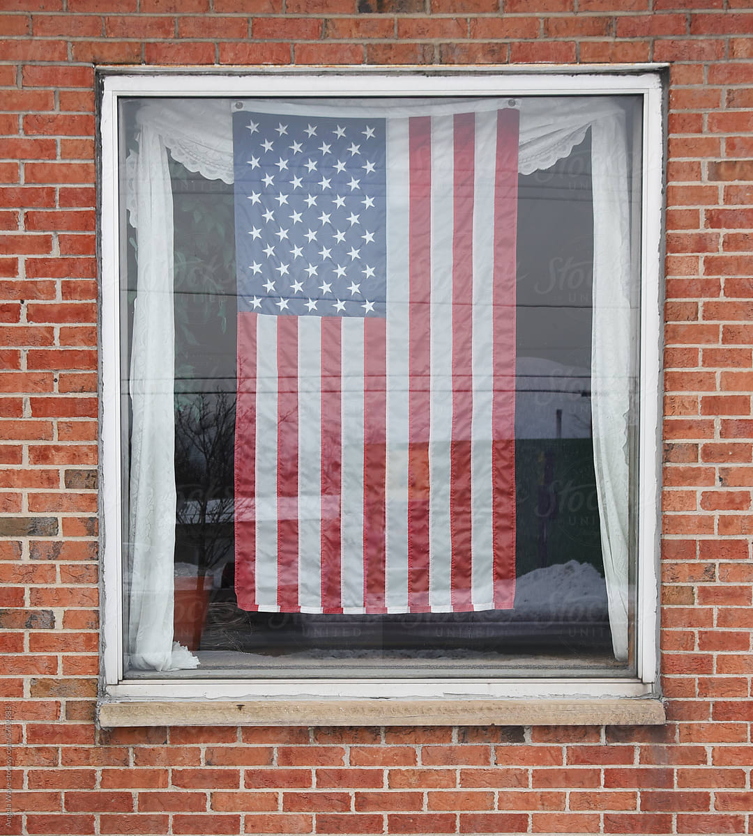 American Flag in Store Window Outside