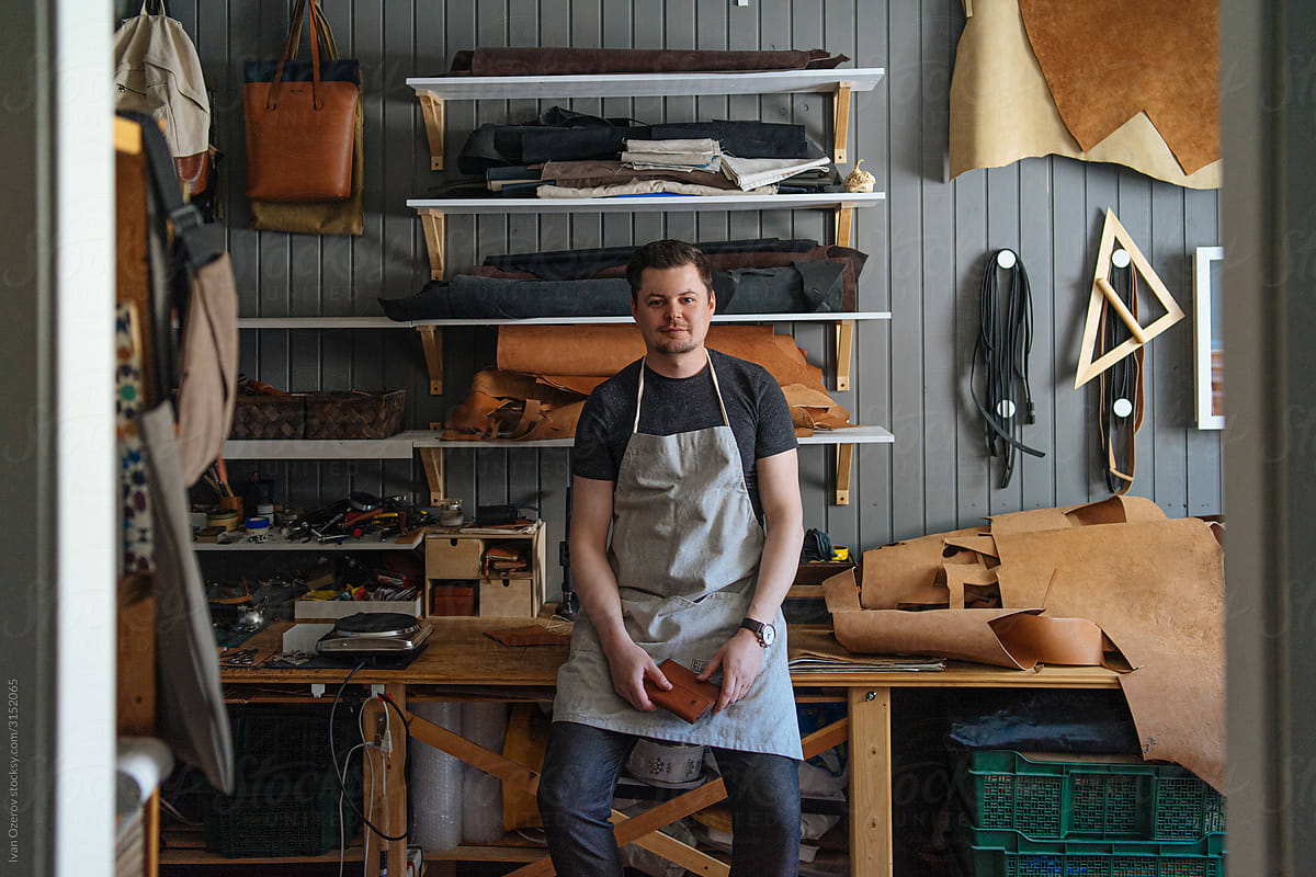 portrait of a craftsman craftsman in his leather workshop