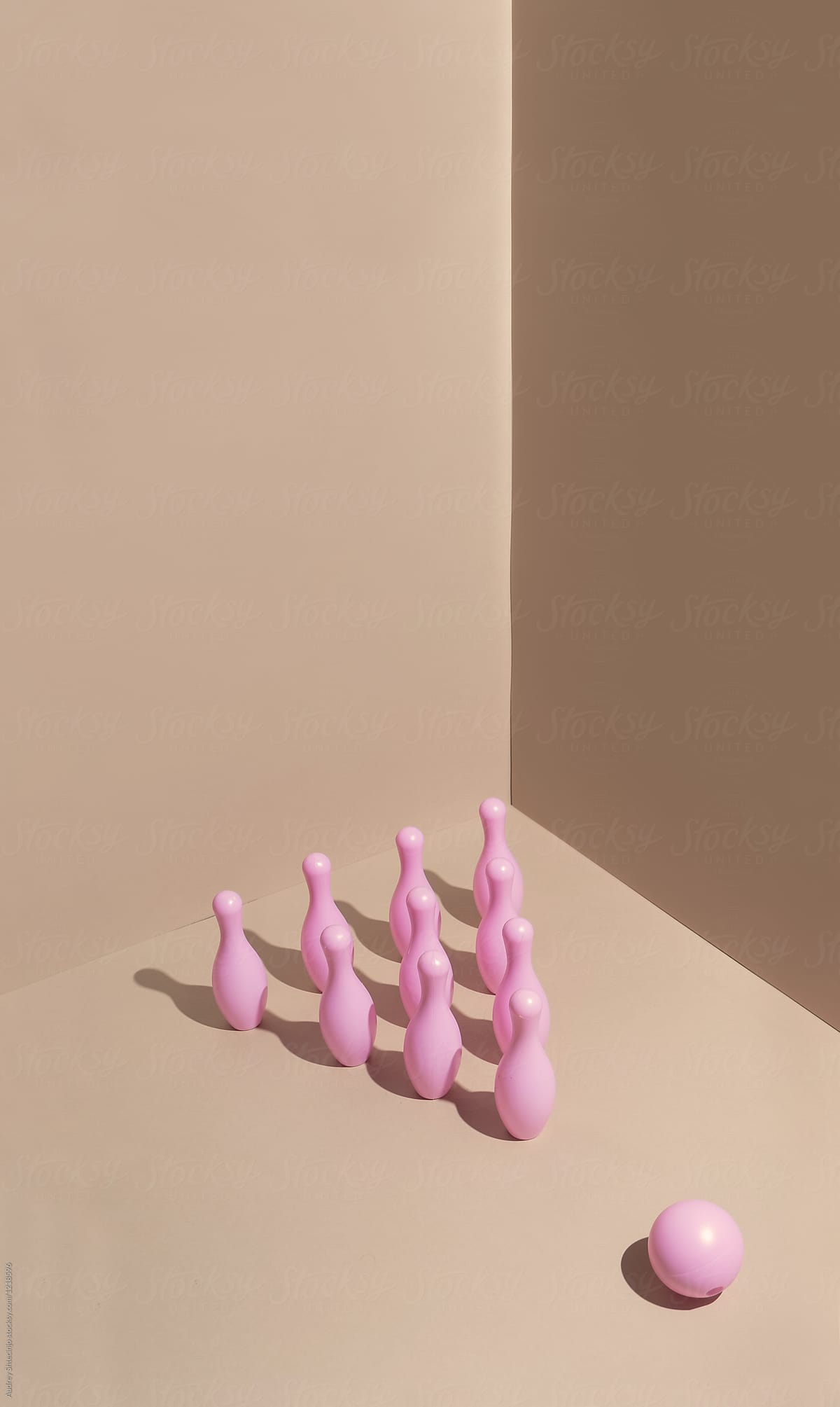 Pink bowling pins in space ready for game