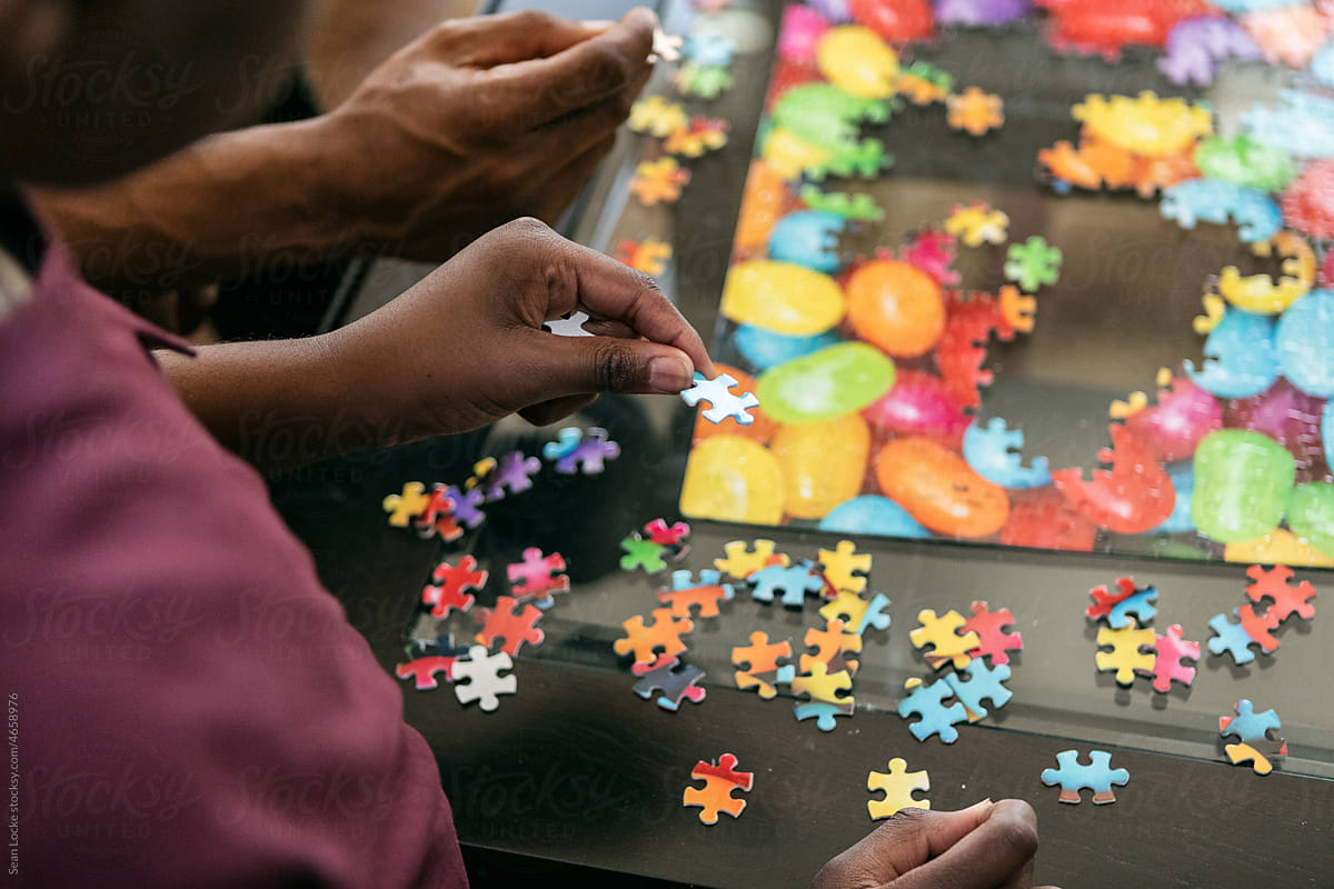 Father And Son Work Together On Fun Puzzle