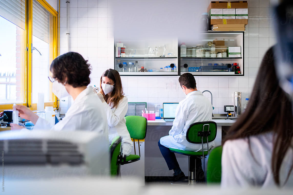 A Group Of Scientists Researching In A Laboratory.