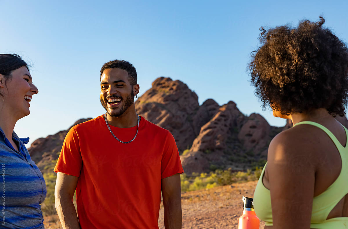 Young black man laughing while on hike with friends