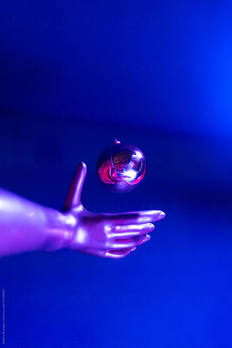 Colorful concept of dummy\'s hand with glass ball