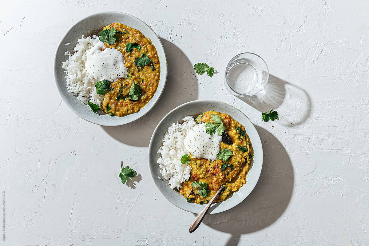 Lentil dal with spinach, tomatoes, rice and yogurt