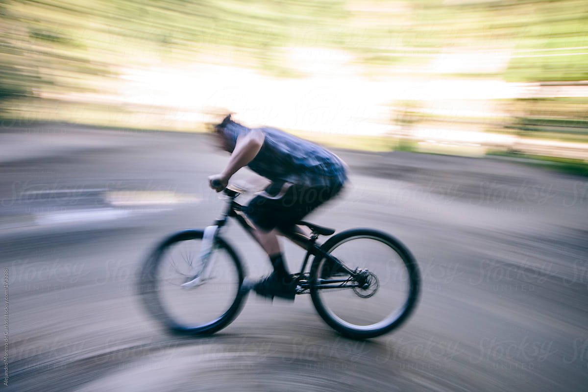 Man riding bike on pump track. Speed blurred image
