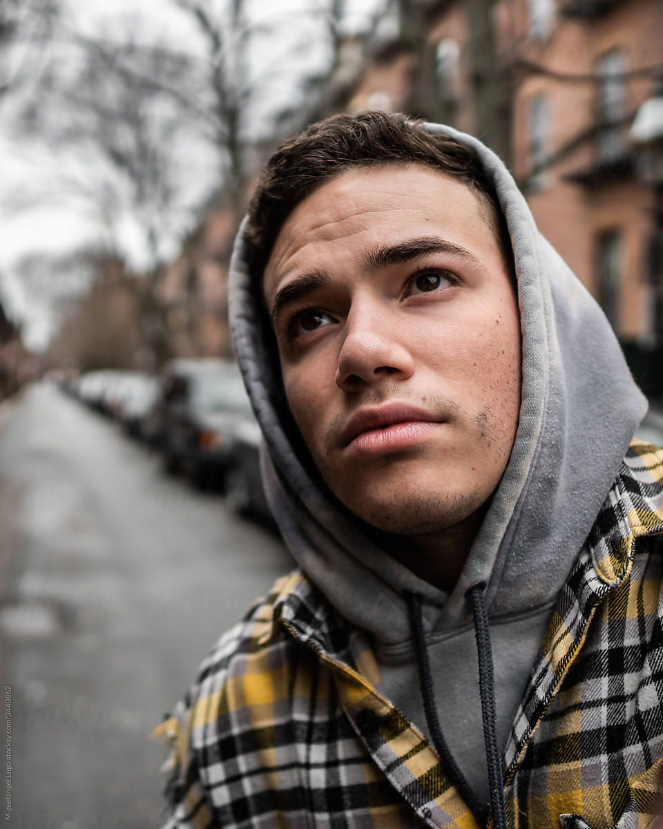 Young Man with Hoodie in City Street