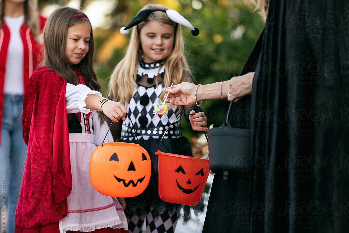Halloween Children Getting Candy From Shop Owner