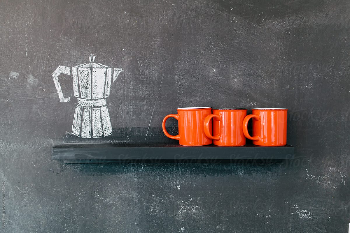 Photo of three red coffee cups with a drawn coffee pot next to it