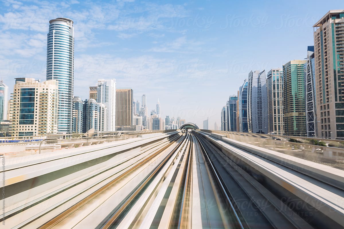 Rail tracks and skyscraper buildings in metro system. Dubai, United Arab Emirates