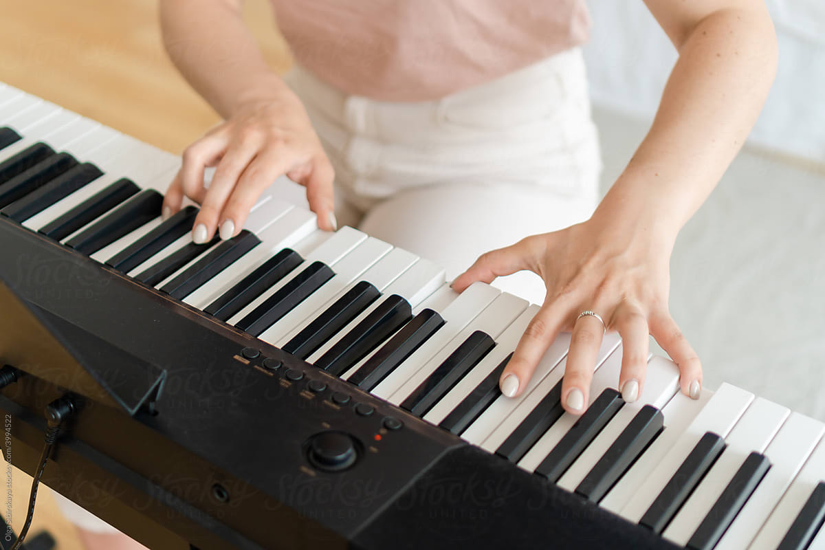Pianist hands on musical keyboard