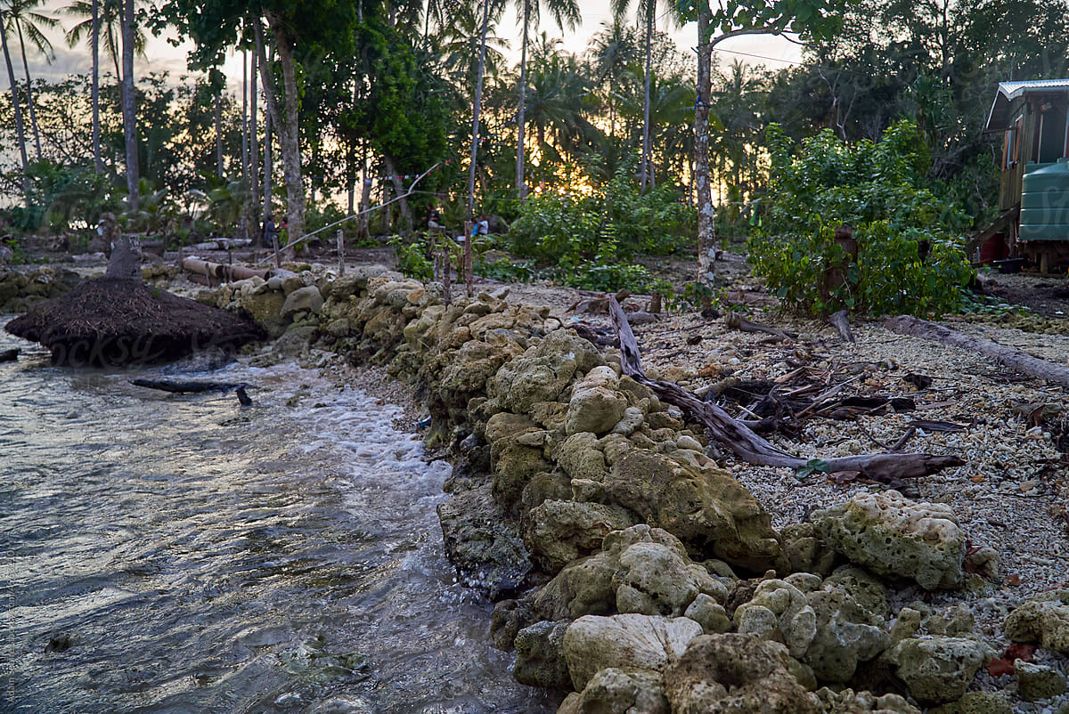 Sea wall built of dead coral - coastal climate change adaptation levee