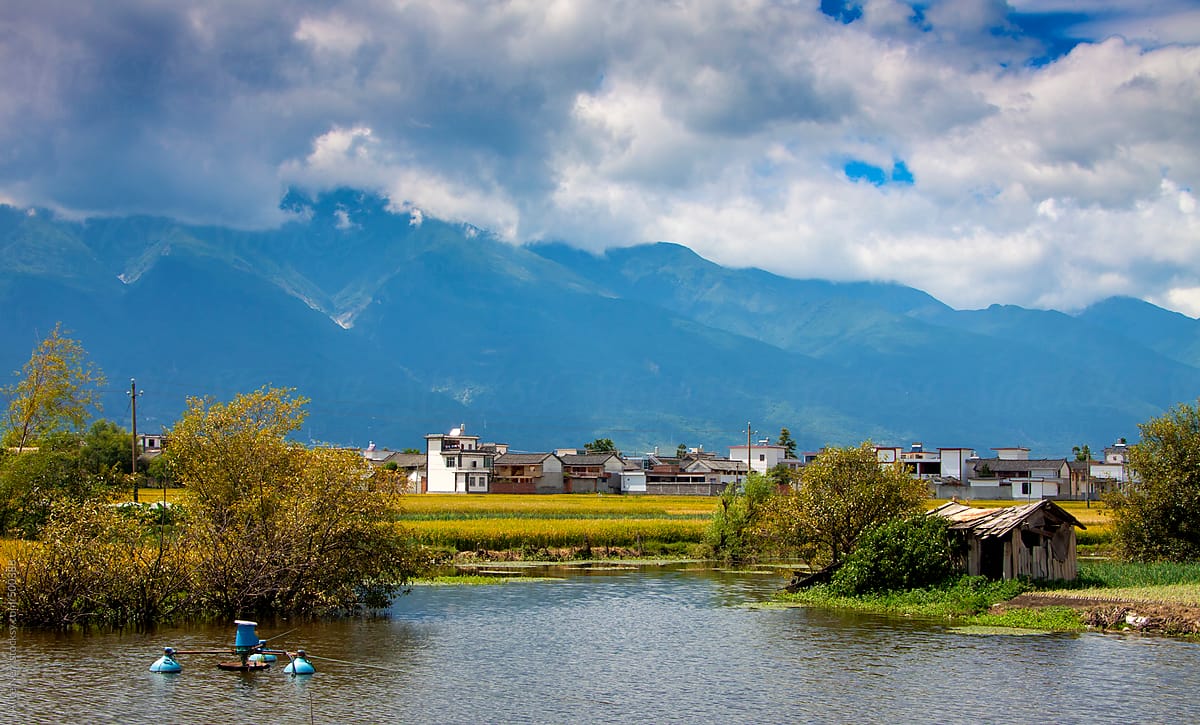 Summer view to the lake and traditional Chinese village