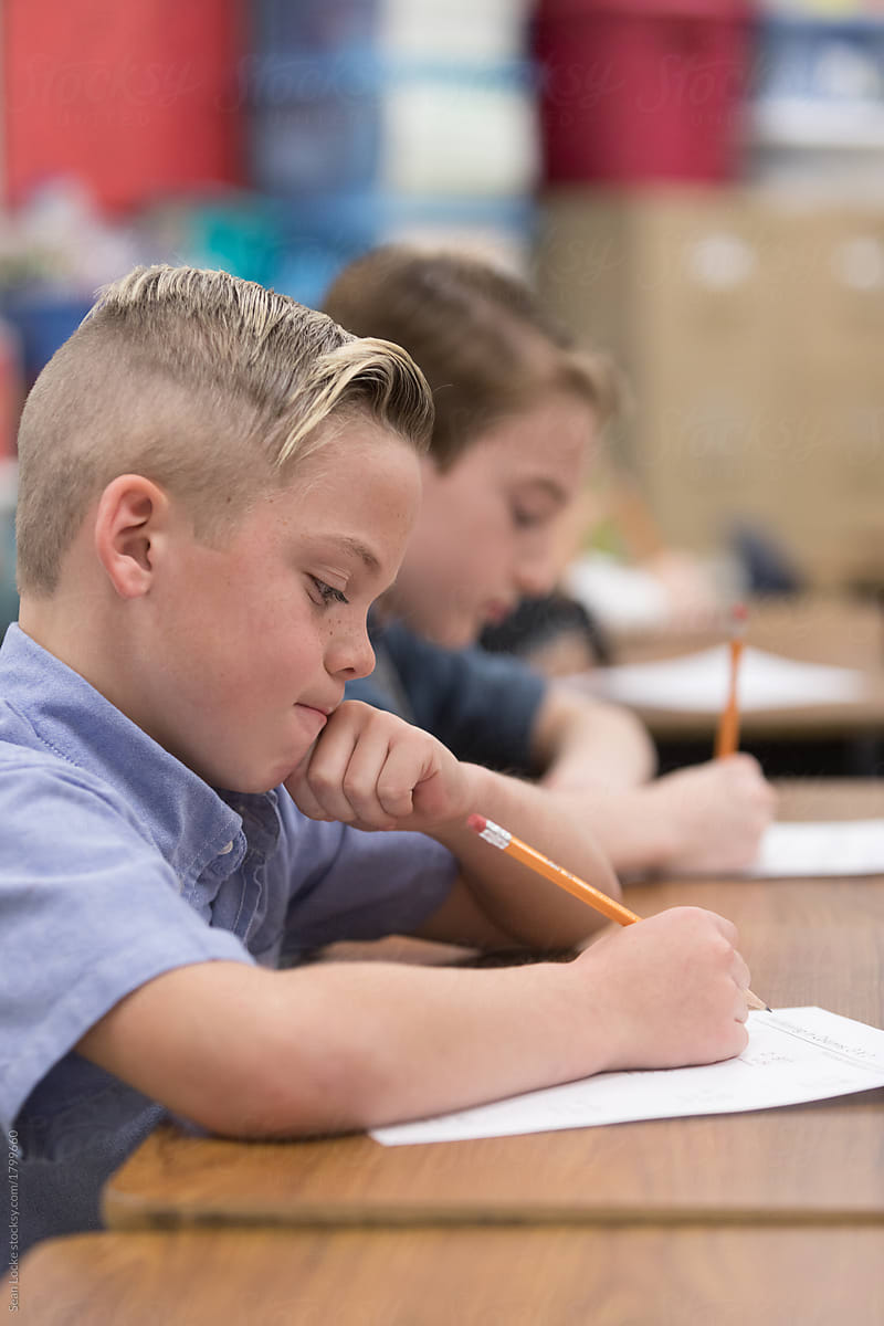 Classroom: Young Boy Thinking While Taking Test