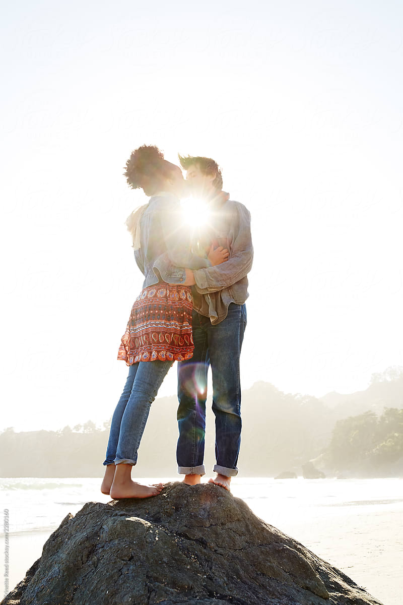 Couple Kissing In Nature At Sunset By Stocksy Contributor Trinette