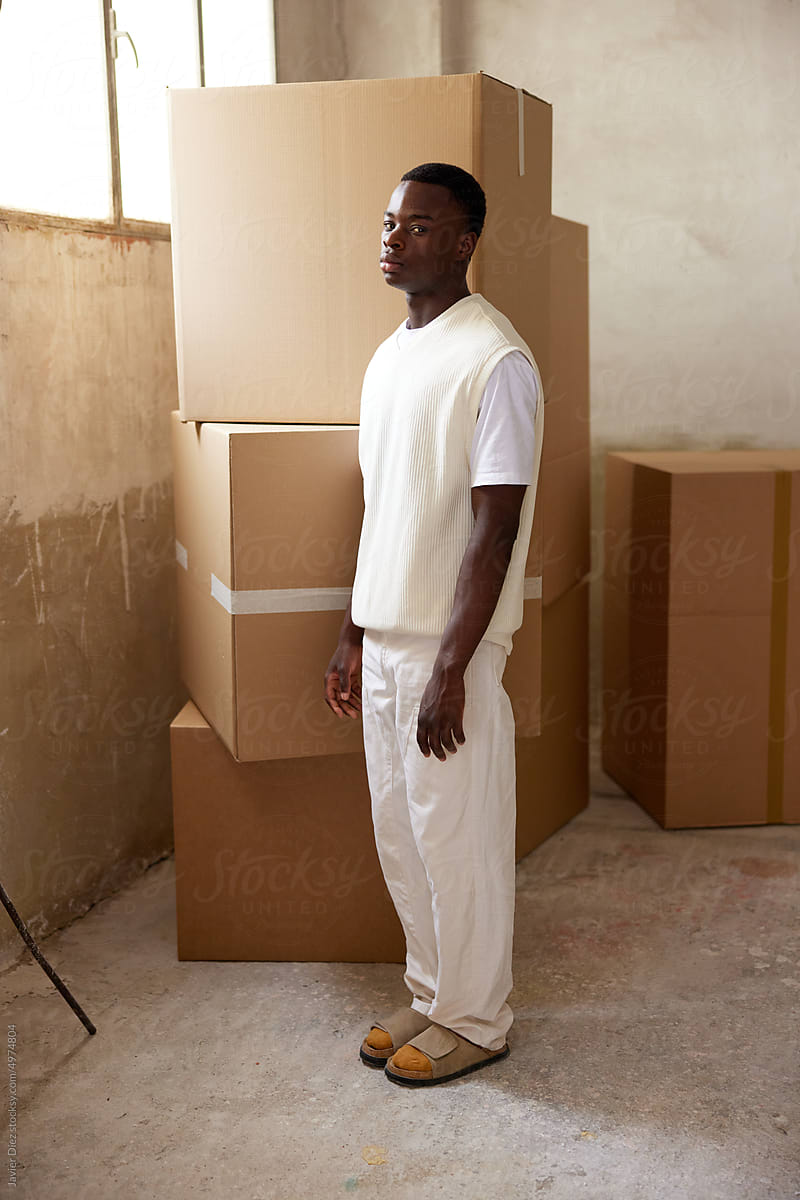 Storehouse worker near boxes