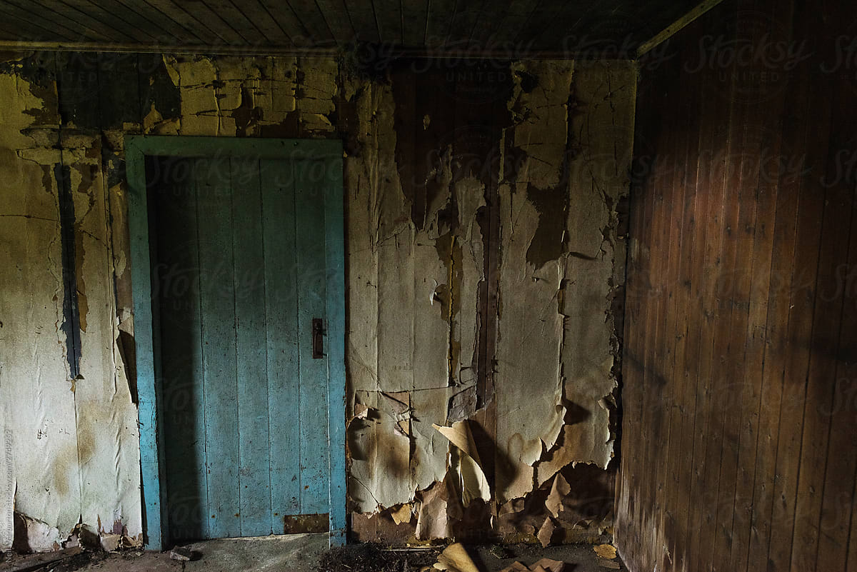 Abandoned room with blue door