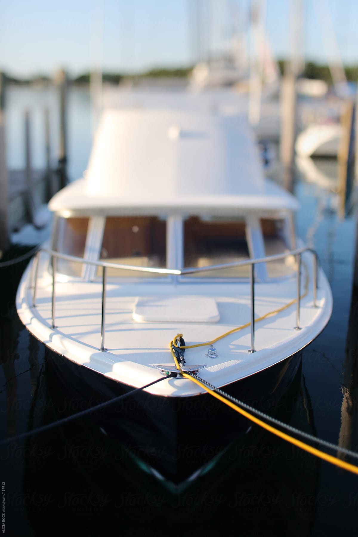 The Bow Of A Clean Boat Tied In The Harbor