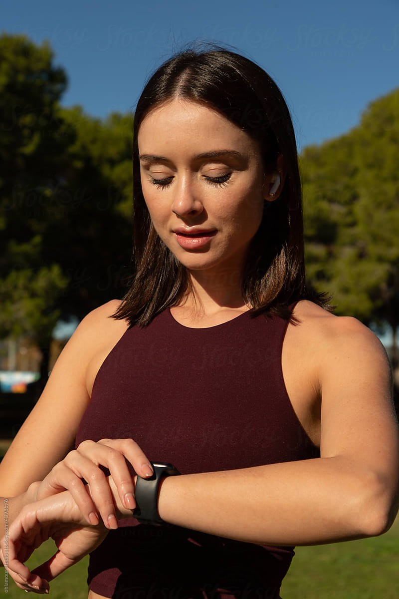 A workout woman checking on smartwatch her results