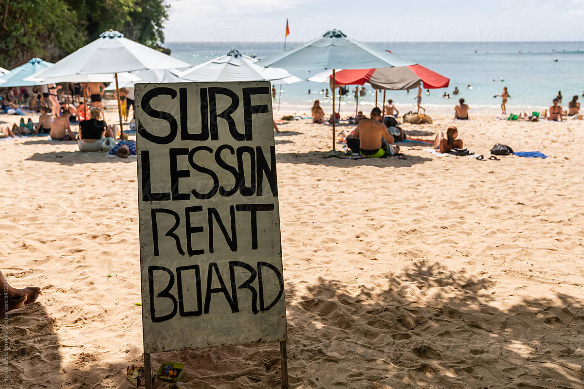 Signboard of Surf Lessons And Board Rent On The Beach
